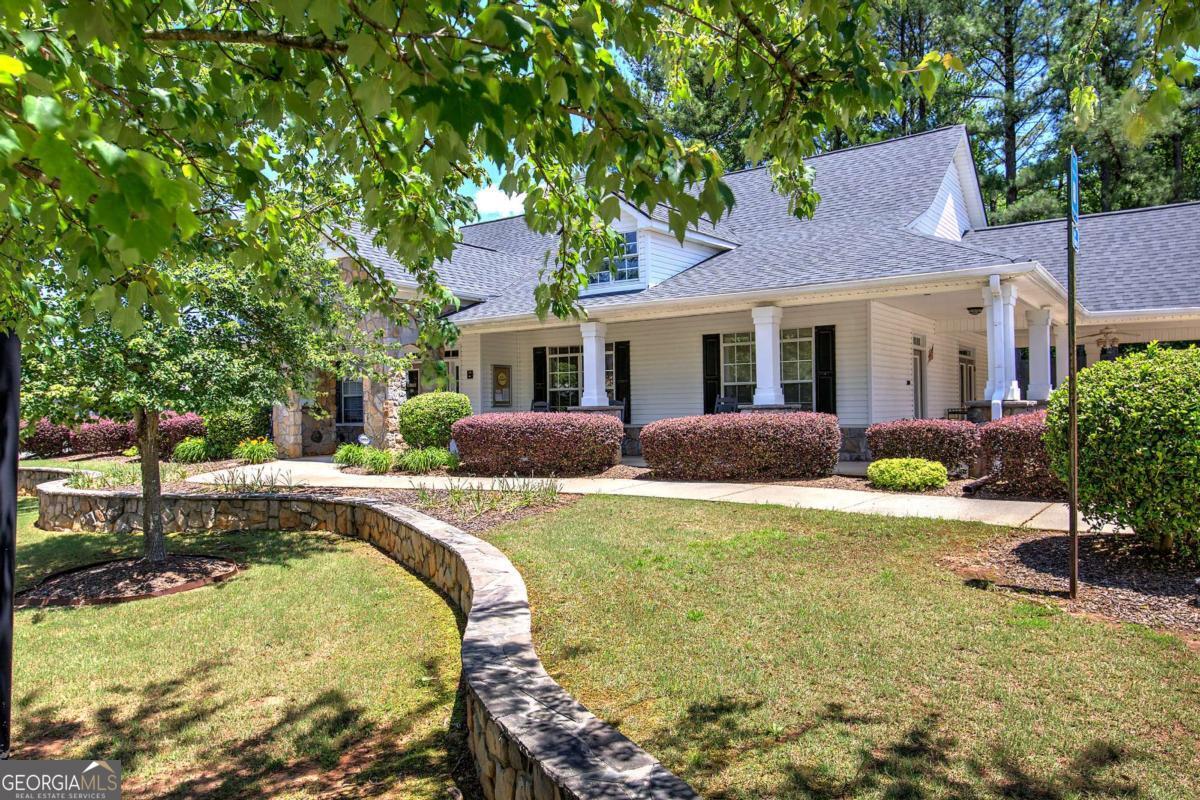 150 Old Mill Road, Unit 123 Cartersville, GA 30120 - Photo 25 of 27 a view of a house with backyard and sitting area