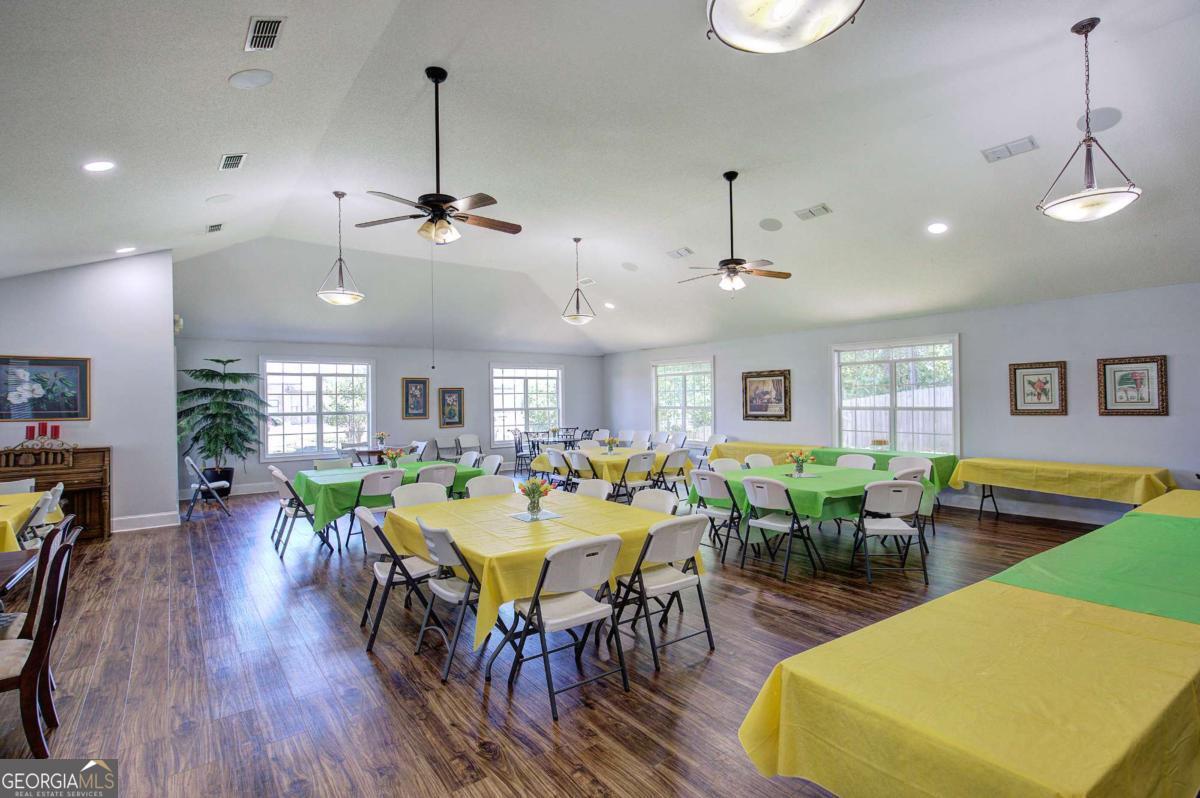150 Old Mill Road, Unit 123 Cartersville, GA 30120 - Photo 26 of 27 a view of a dining room with furniture window and wooden floor