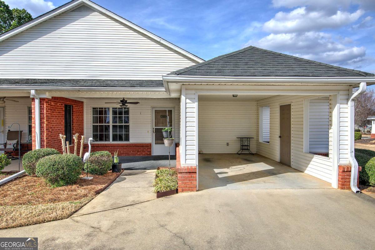 150 Old Mill Road, Unit 123 Cartersville, GA 30120 - Photo 3 of 27 a front view of a house with garden
