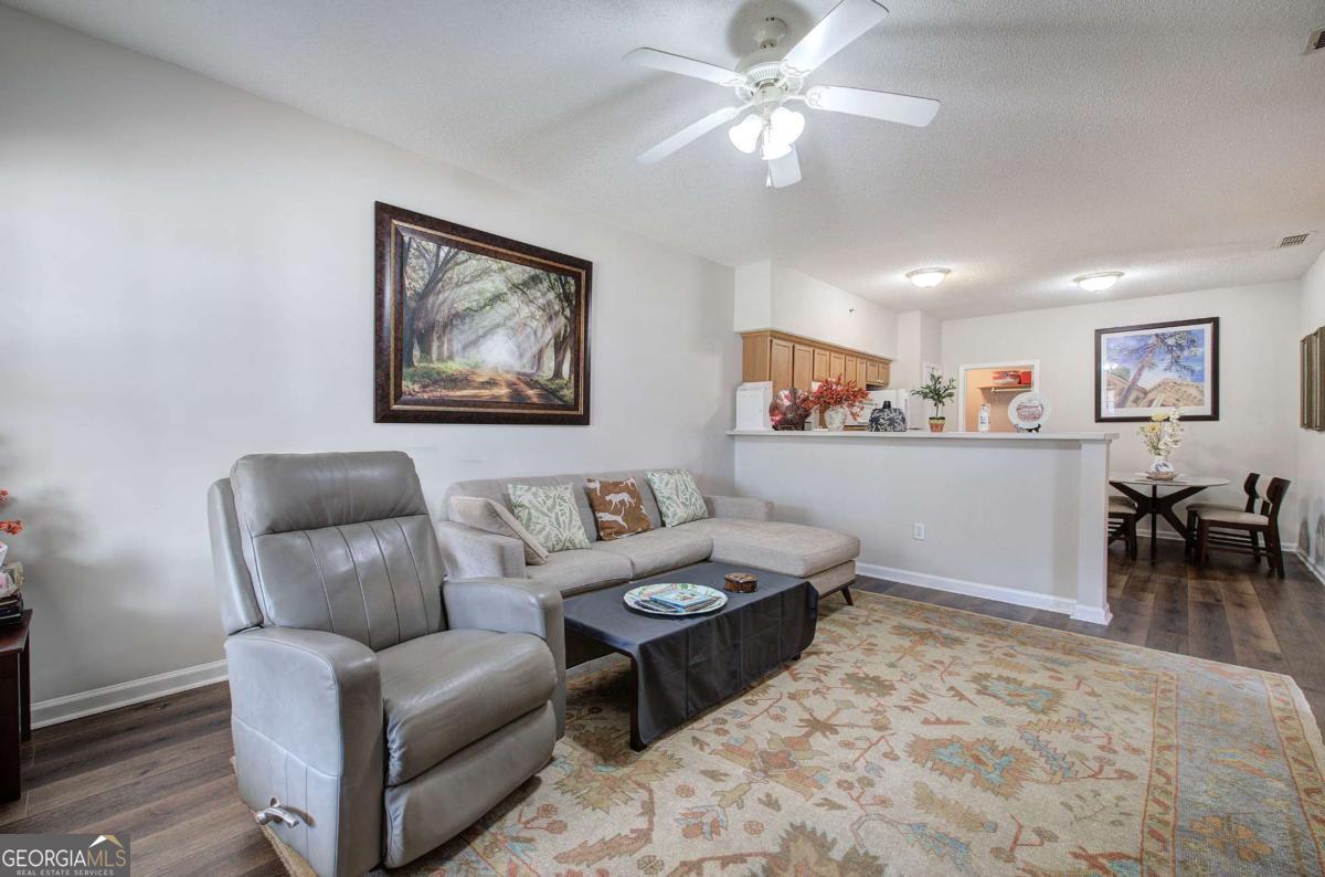150 Old Mill Road, Unit 123 Cartersville, GA 30120 - Photo 5 of 27 a living room with furniture and a dining area