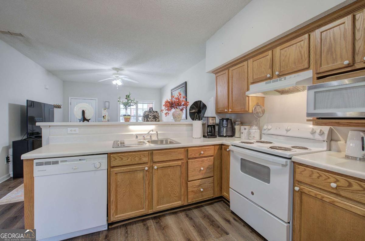 150 Old Mill Road, Unit 123 Cartersville, GA 30120 - Photo 8 of 27 a kitchen with a sink stove and cabinets