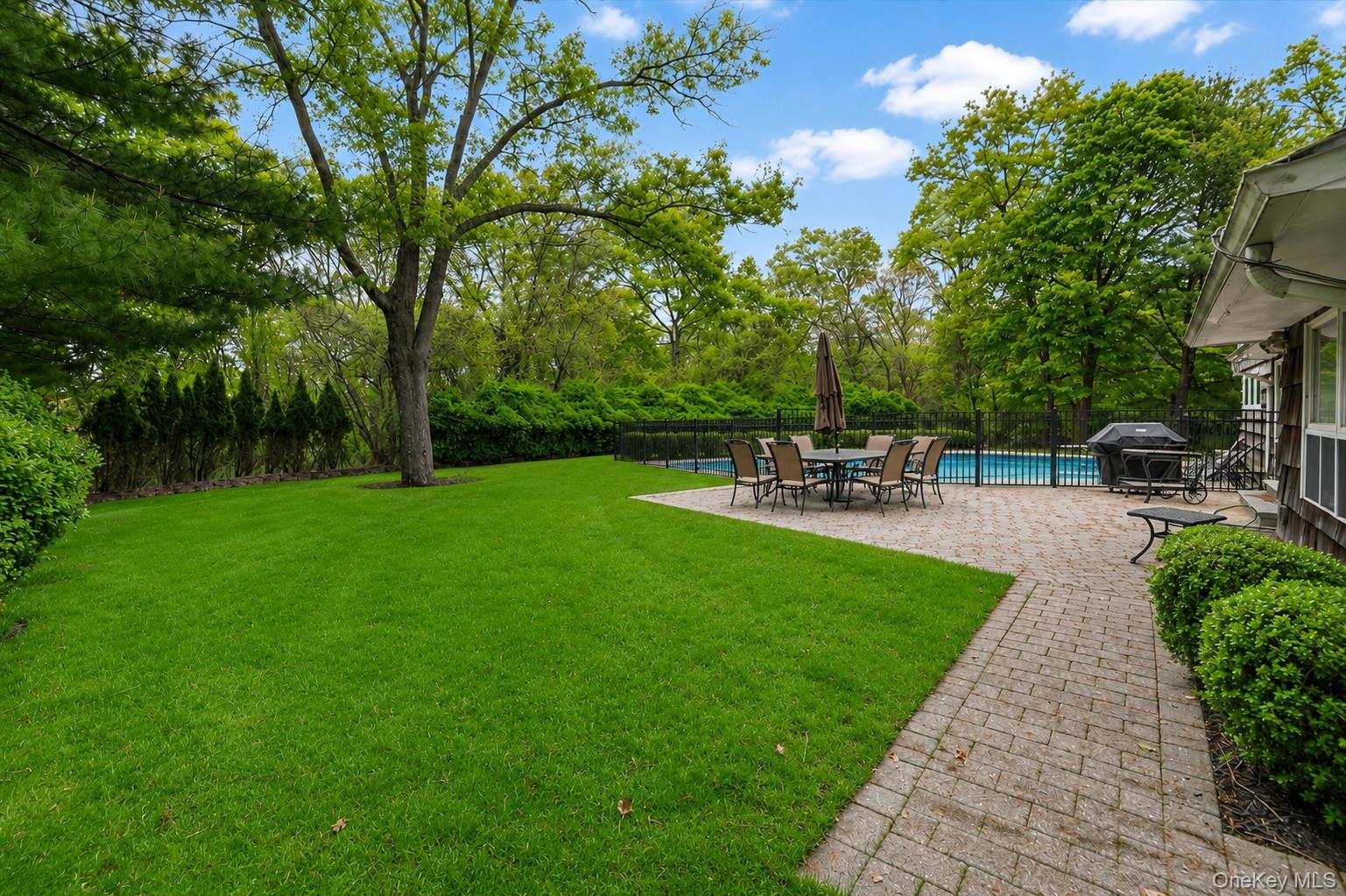 6 Apex Road Melville, NY 11747 - Photo 42 of 50 a view of a backyard with sitting area