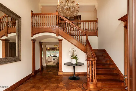 a view of entryway livingroom and hall with wooden floor