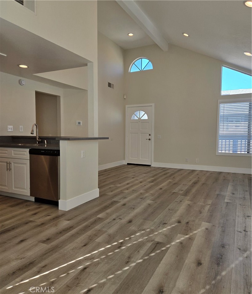 377 Huntington Irvine, CA 92620 - Photo 3 of 8 an empty room with wooden floor and windows