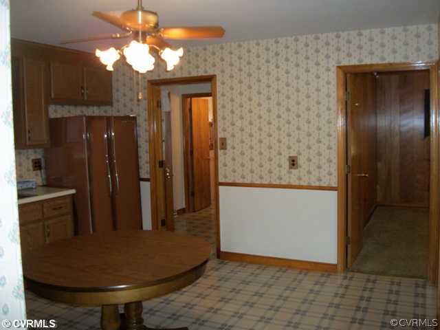 6328 Commander Road Richmond, VA 23224 - Photo 6 of 12 a view of a livingroom with a chandelier