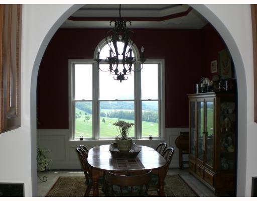 Dining Room. Dining room is picture perfect for holidays with decorative double tray ceiling, accent lighting.and patterned travertine and granite flooring.