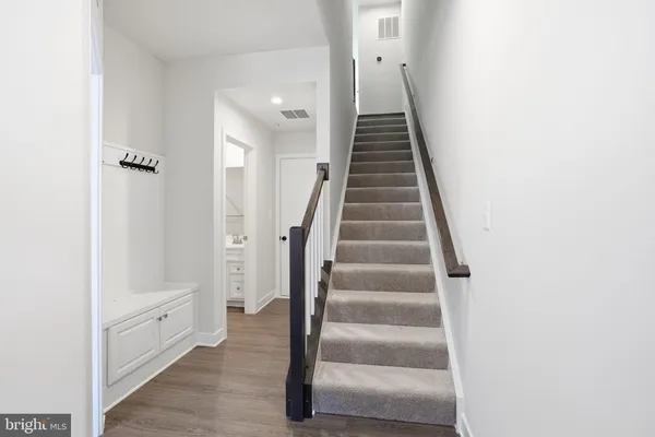 a view of an entryway with wooden floor