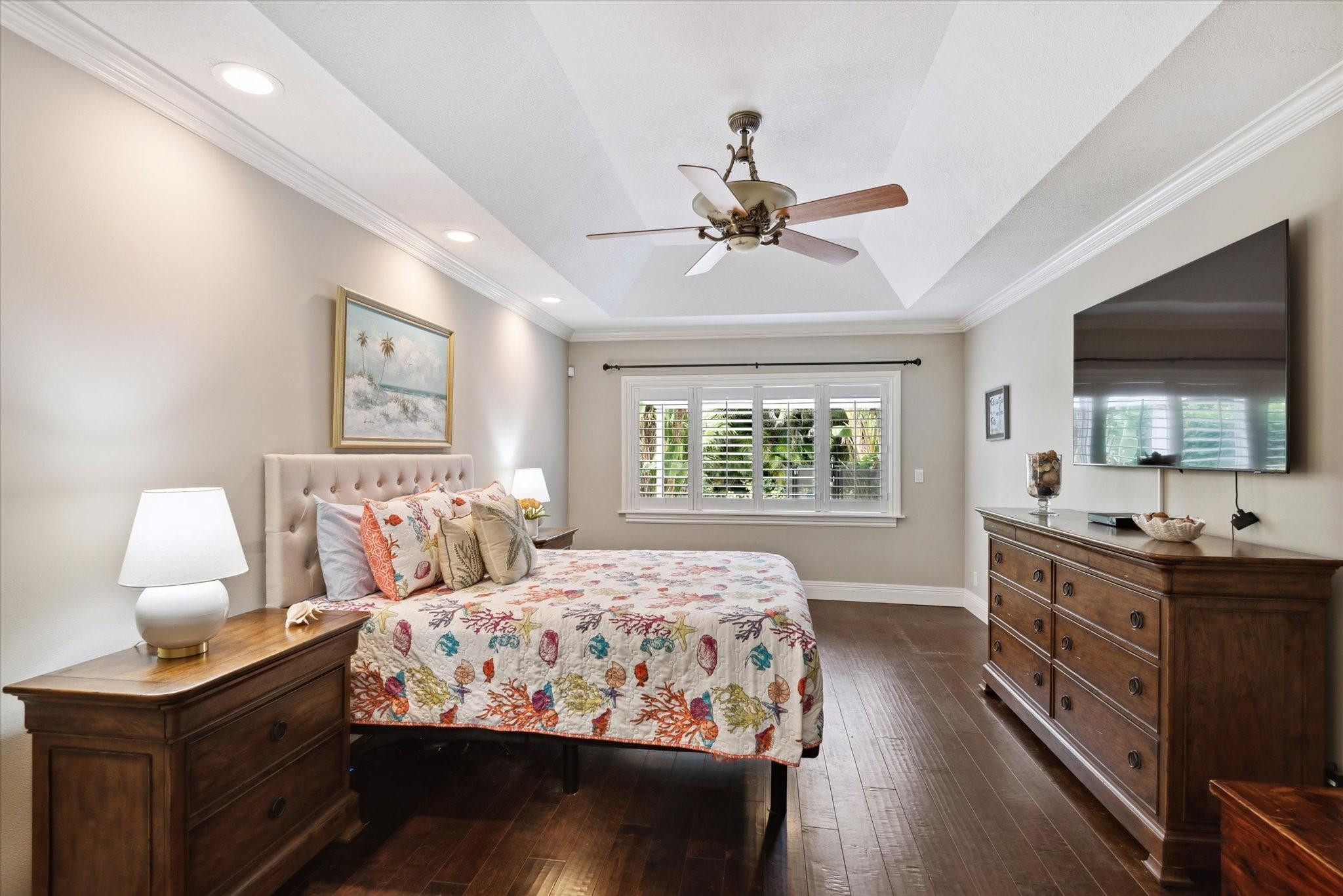 1055 Parkside Circle North Boca Raton, FL 33486 - Photo 11 of 24 a bedroom with a bed and a flat screen tv