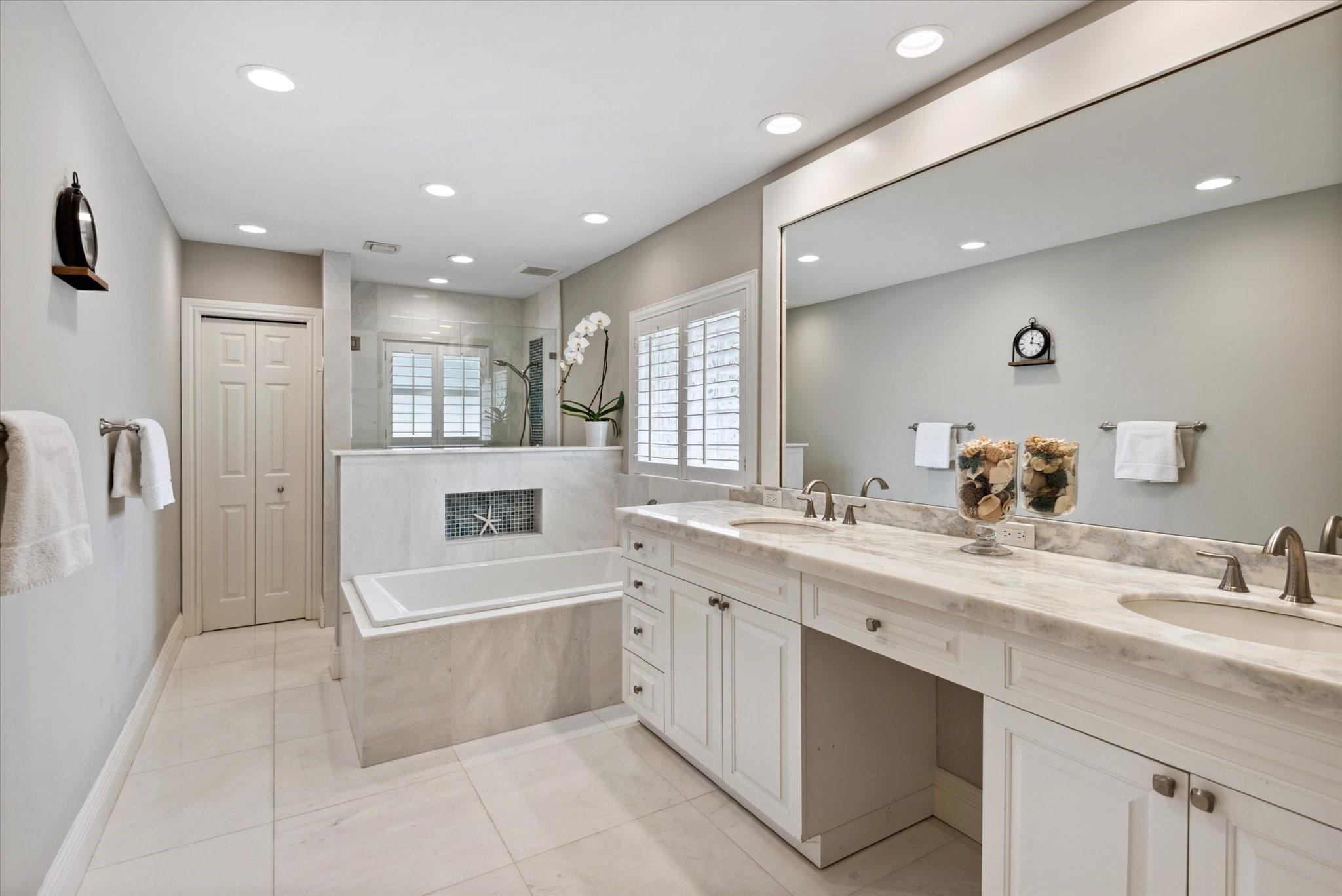 1055 Parkside Circle North Boca Raton, FL 33486 - Photo 12 of 24 a large white kitchen with a white countertops a sink and a refrigerator