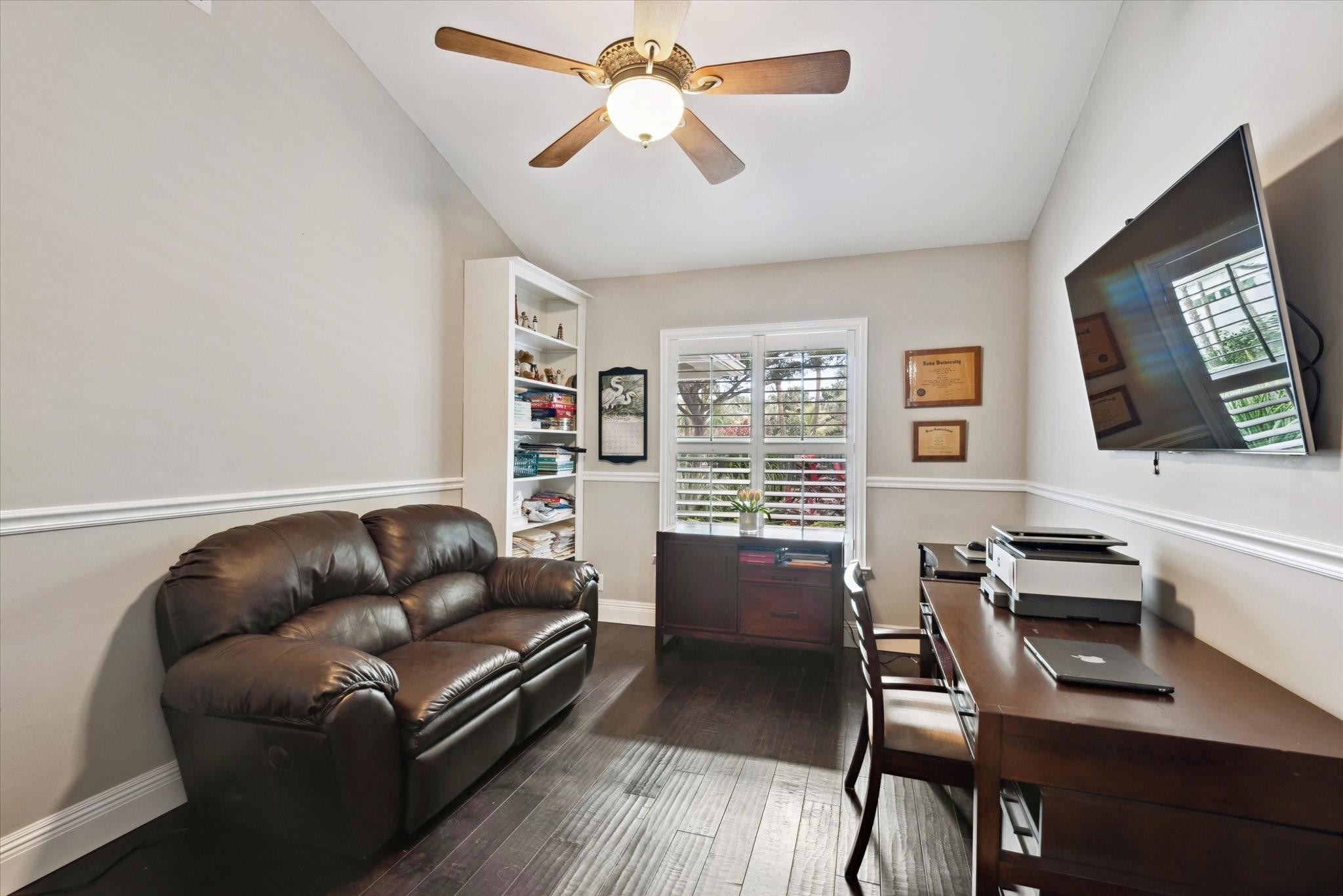 1055 Parkside Circle North Boca Raton, FL 33486 - Photo 15 of 24 a living room with furniture a flat screen tv and a window