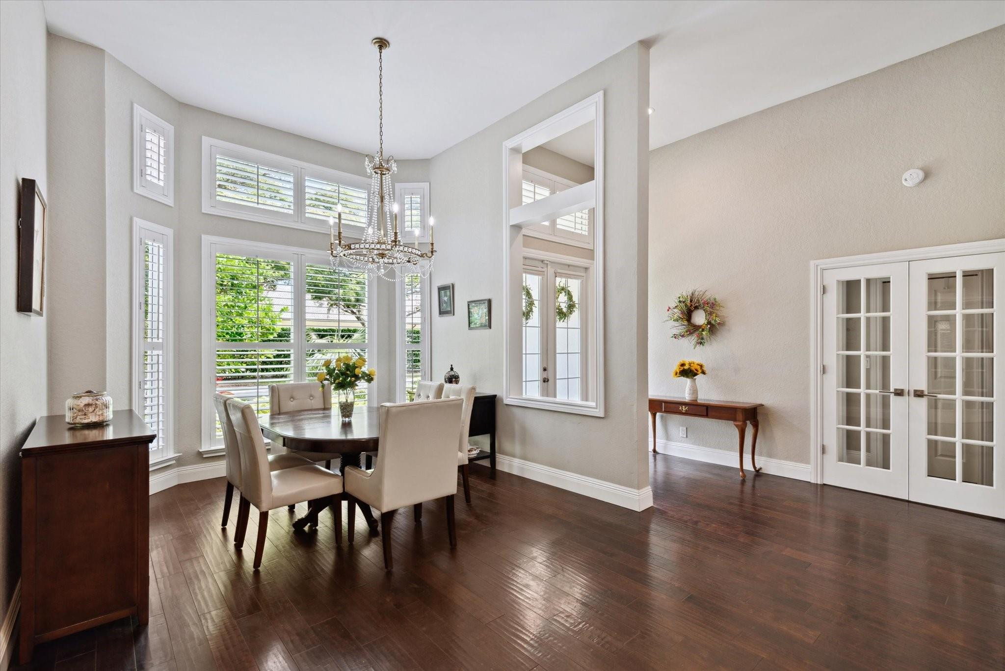 1055 Parkside Circle North Boca Raton, FL 33486 - Photo 2 of 24 a view of a dining room with furniture window and wooden floor
