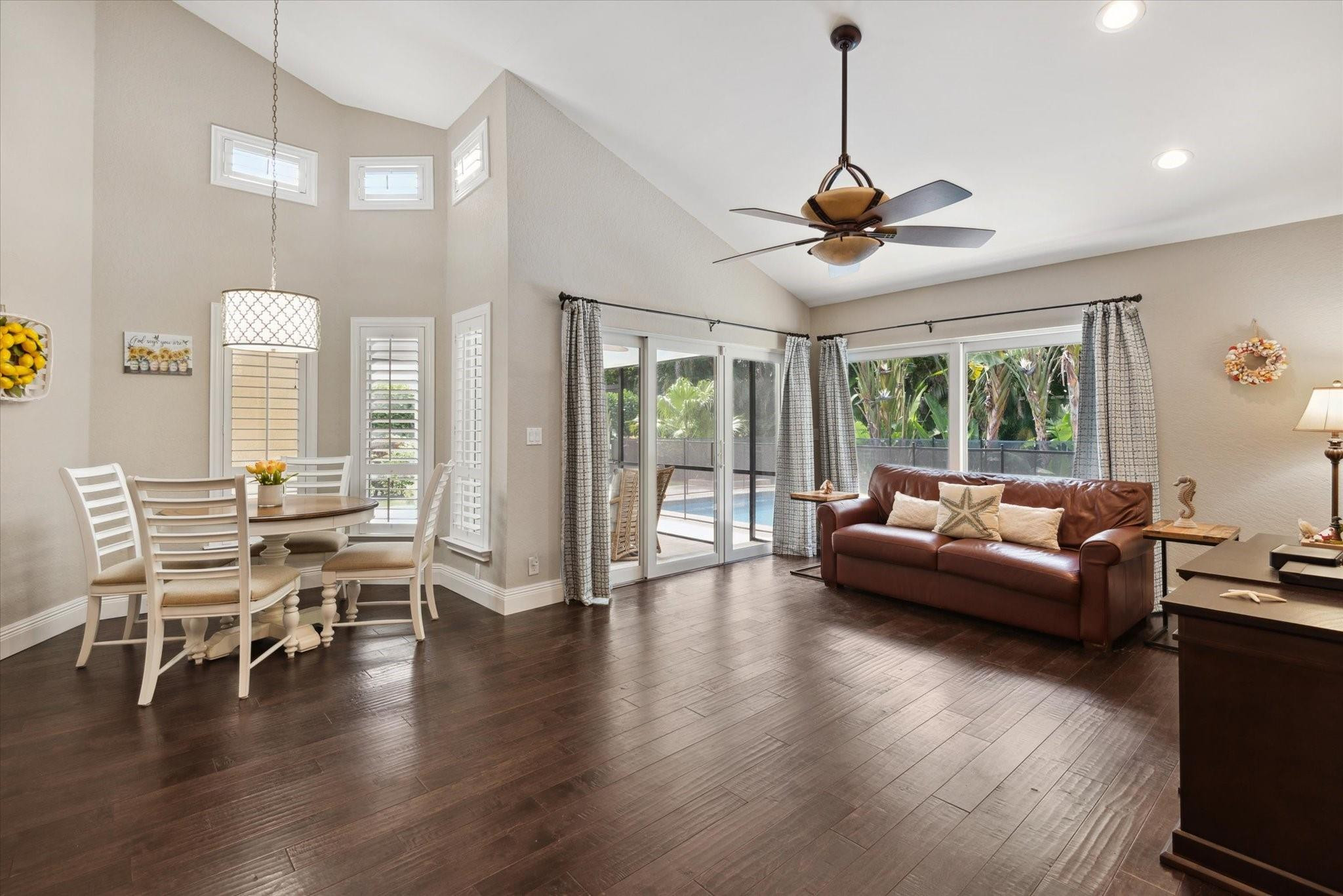1055 Parkside Circle North Boca Raton, FL 33486 - Photo 6 of 24 a living room with couches a fireplace and wooden floor