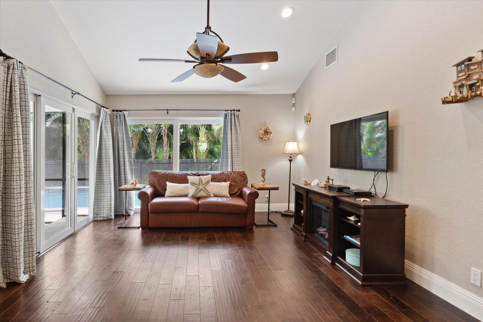 1055 Parkside Circle North Boca Raton, FL 33486 - Photo 7 of 24 a living room with furniture and a flat screen tv