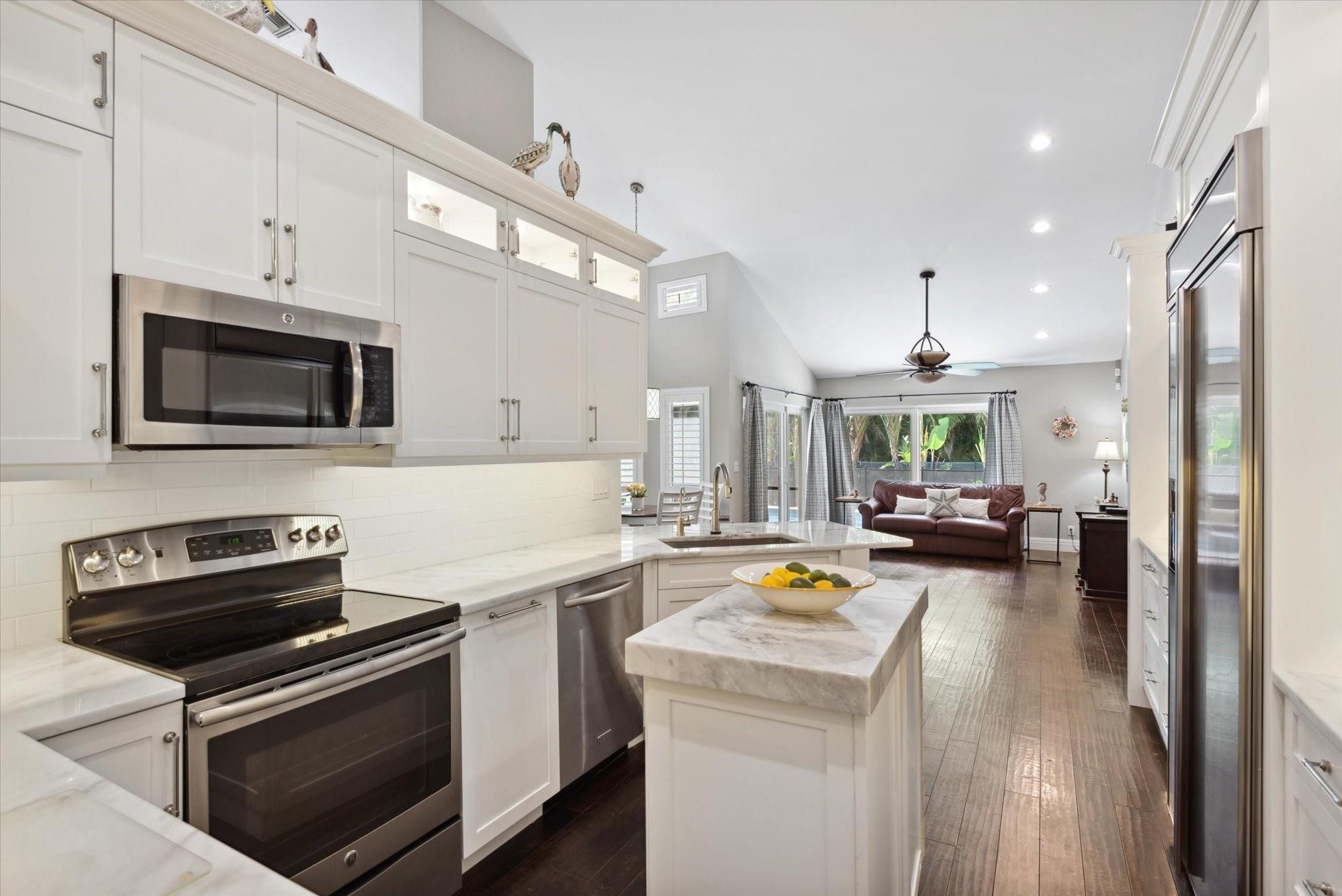 1055 Parkside Circle North Boca Raton, FL 33486 - Photo 10 of 24 a kitchen with a stove and a microwave