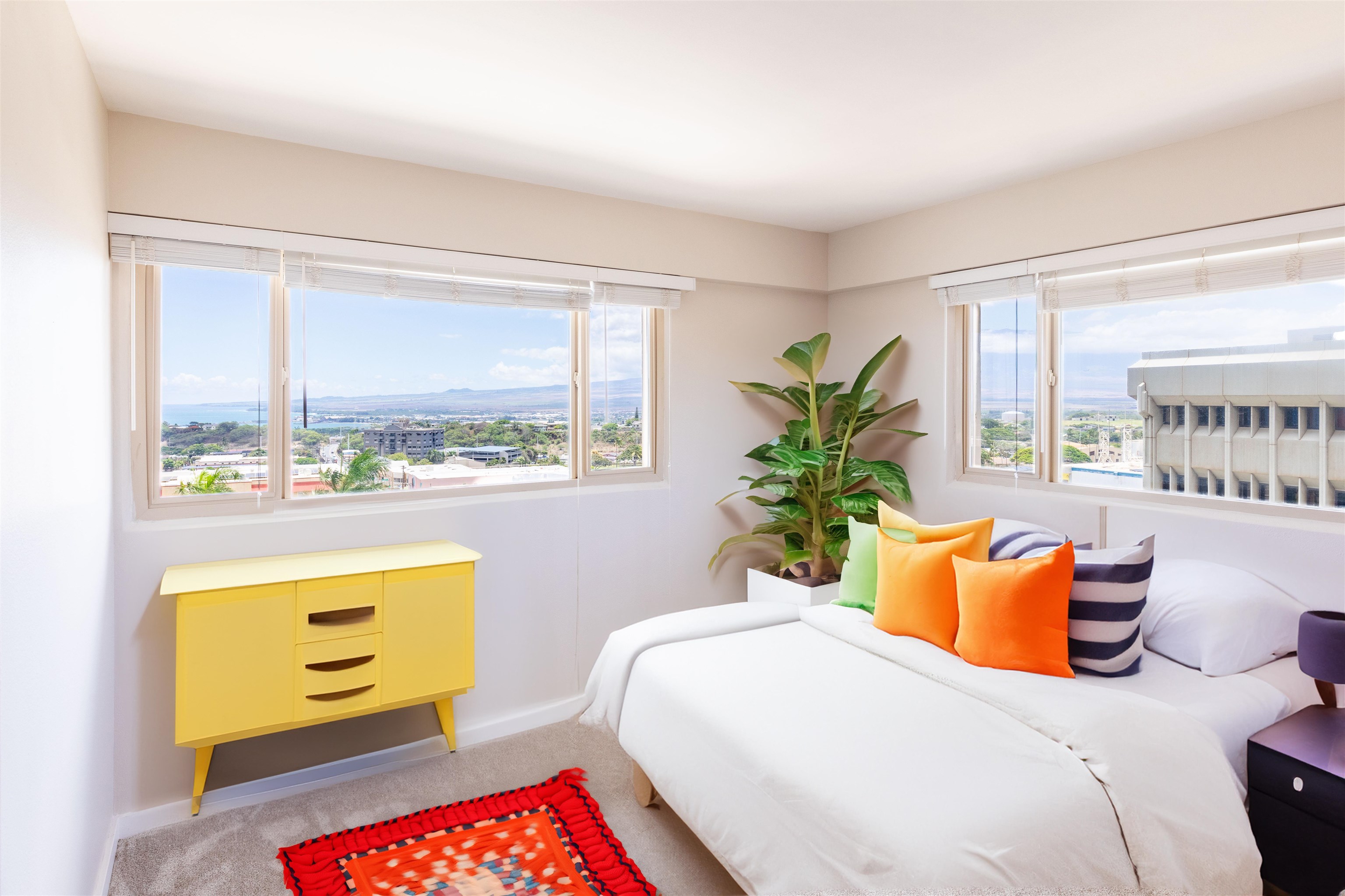 2158 Main Street, Unit 707 Wailuku, HI 96793 - Photo 13 of 27 a bedroom with a bed and a window