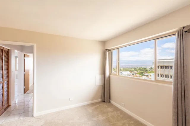 a view of an empty room and window