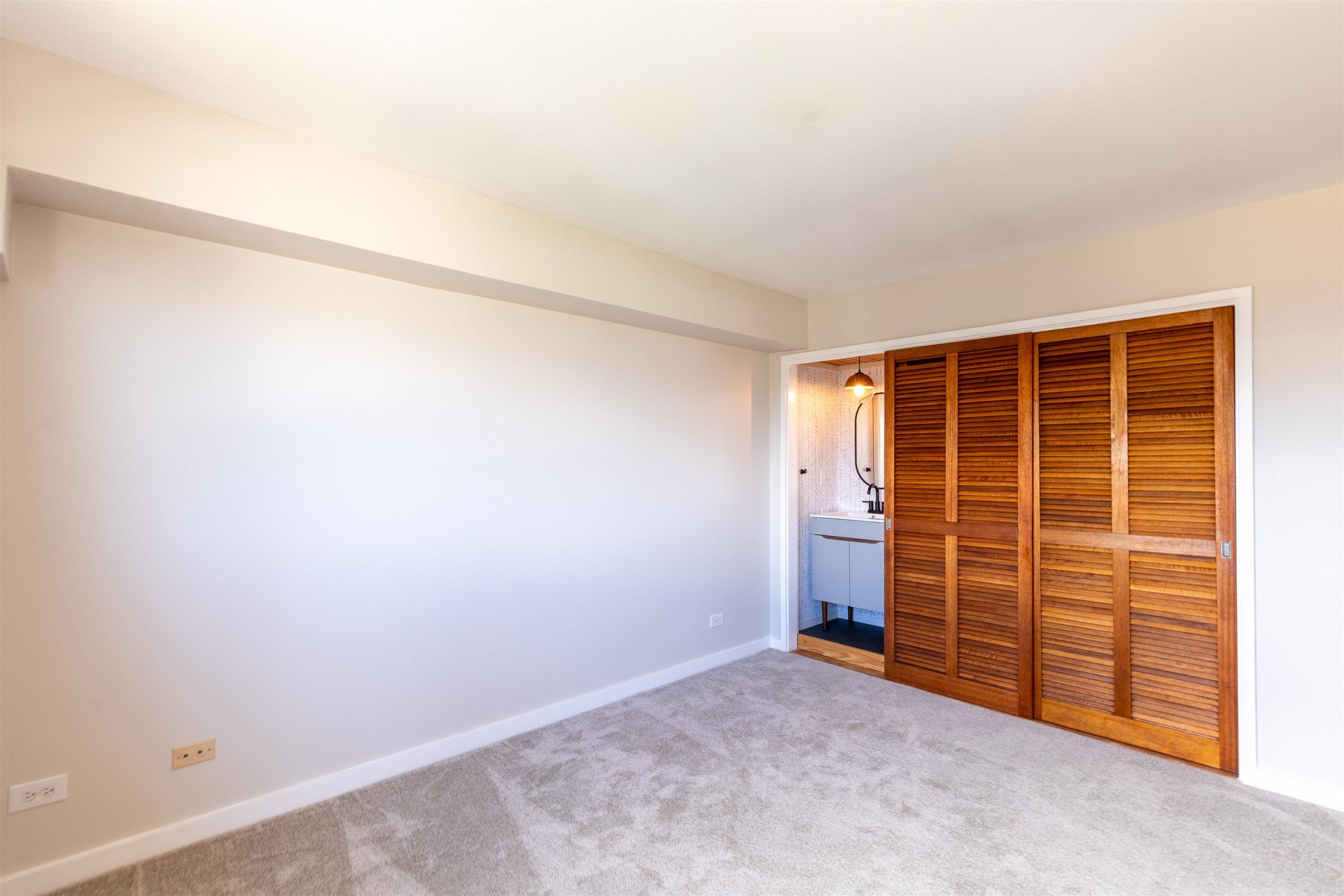 2158 Main Street, Unit 707 Wailuku, HI 96793 - Photo 18 of 27 a view of an empty room with furniture and a window