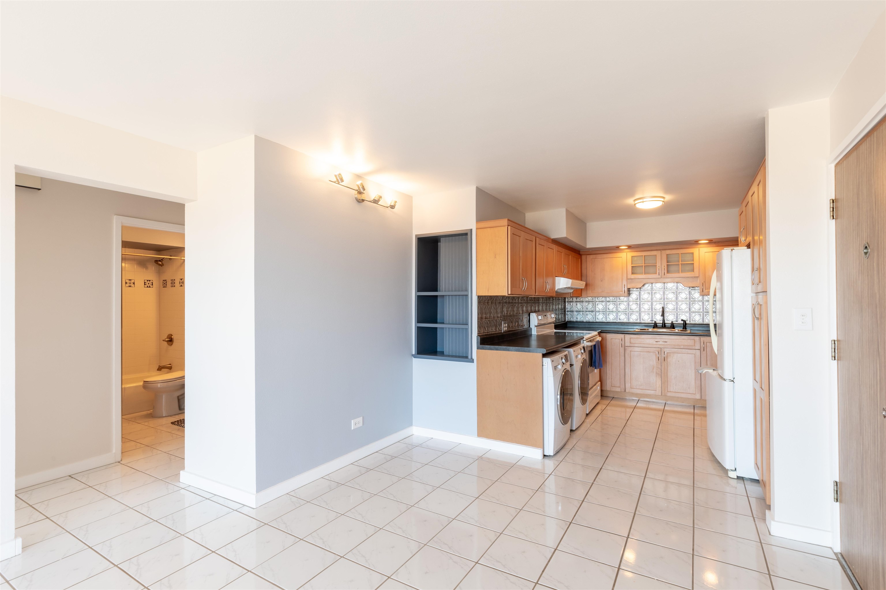 2158 Main Street, Unit 707 Wailuku, HI 96793 - Photo 20 of 27 a kitchen with stainless steel appliances a refrigerator and a stove