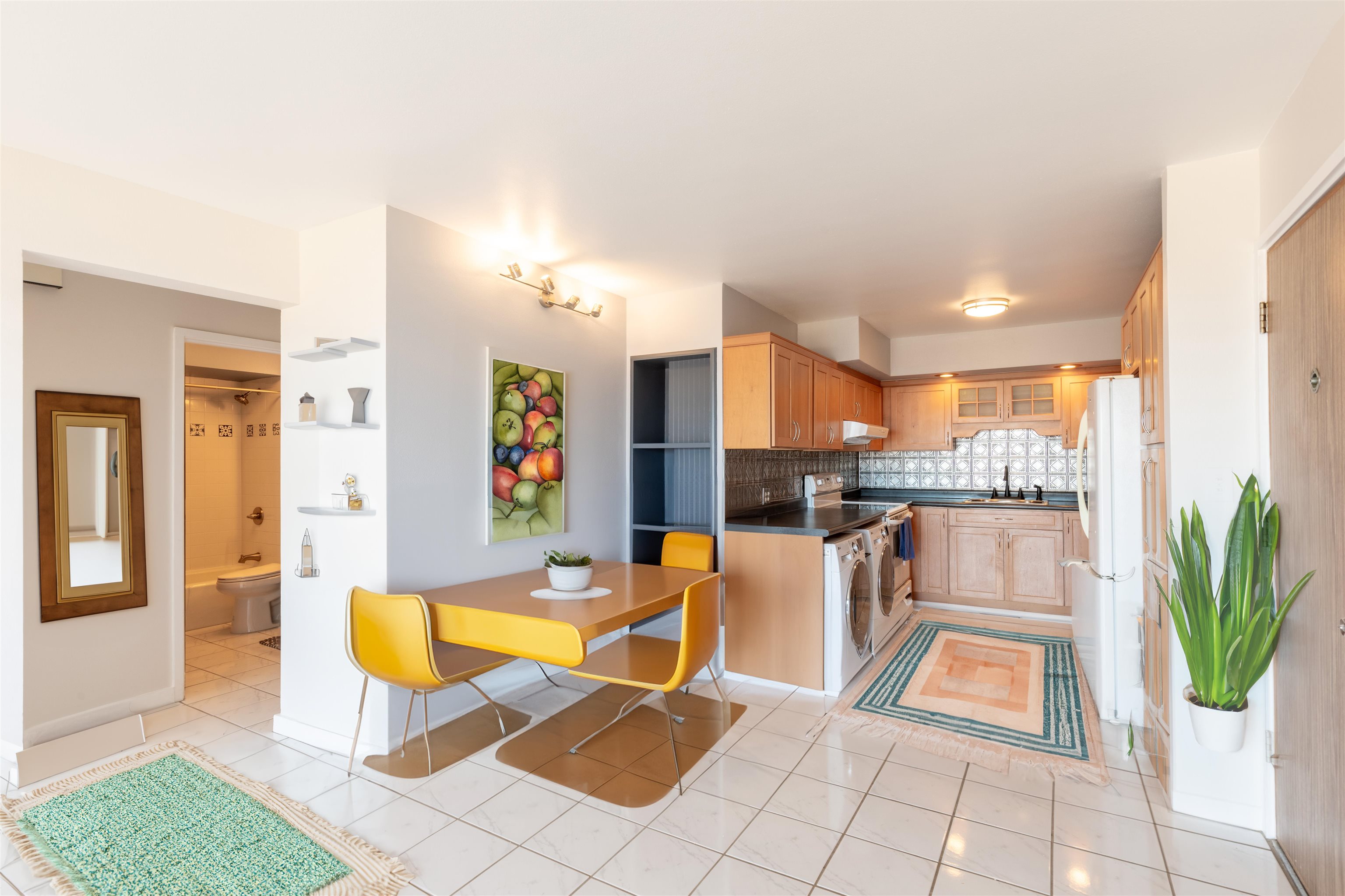 2158 Main Street, Unit 707 Wailuku, HI 96793 - Photo 21 of 27 a living room with furniture a dining table and a potted plant