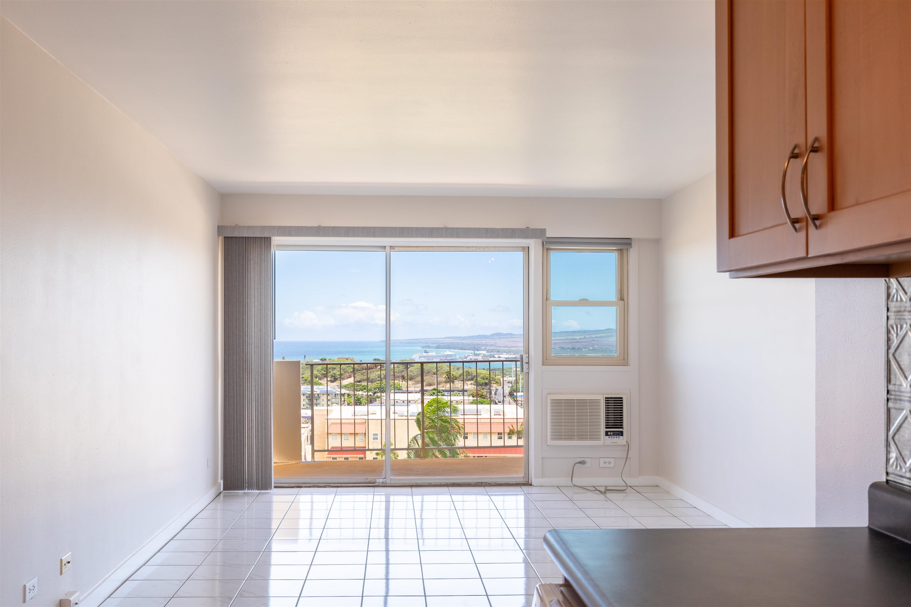 2158 Main Street, Unit 707 Wailuku, HI 96793 - Photo 22 of 27 a view of an empty room with wooden floor and a window