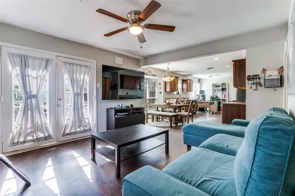a living room with furniture and a flat screen tv