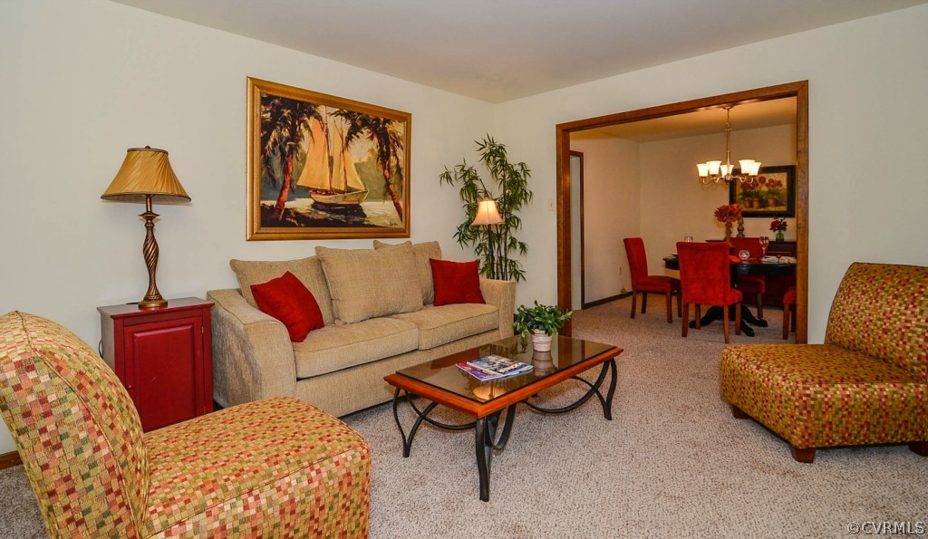 13200 Queensgate Road Midlothian, VA 23114 - Photo 5 of 24 a living room with furniture a lamp and a window