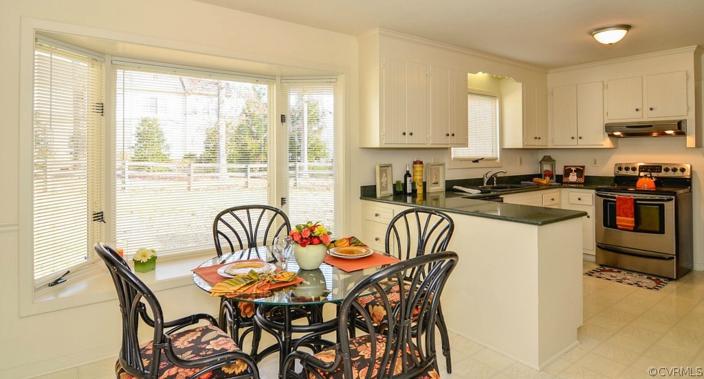 13200 Queensgate Road Midlothian, VA 23114 - Photo 10 of 24 a view of a dining room with furniture window and outside view