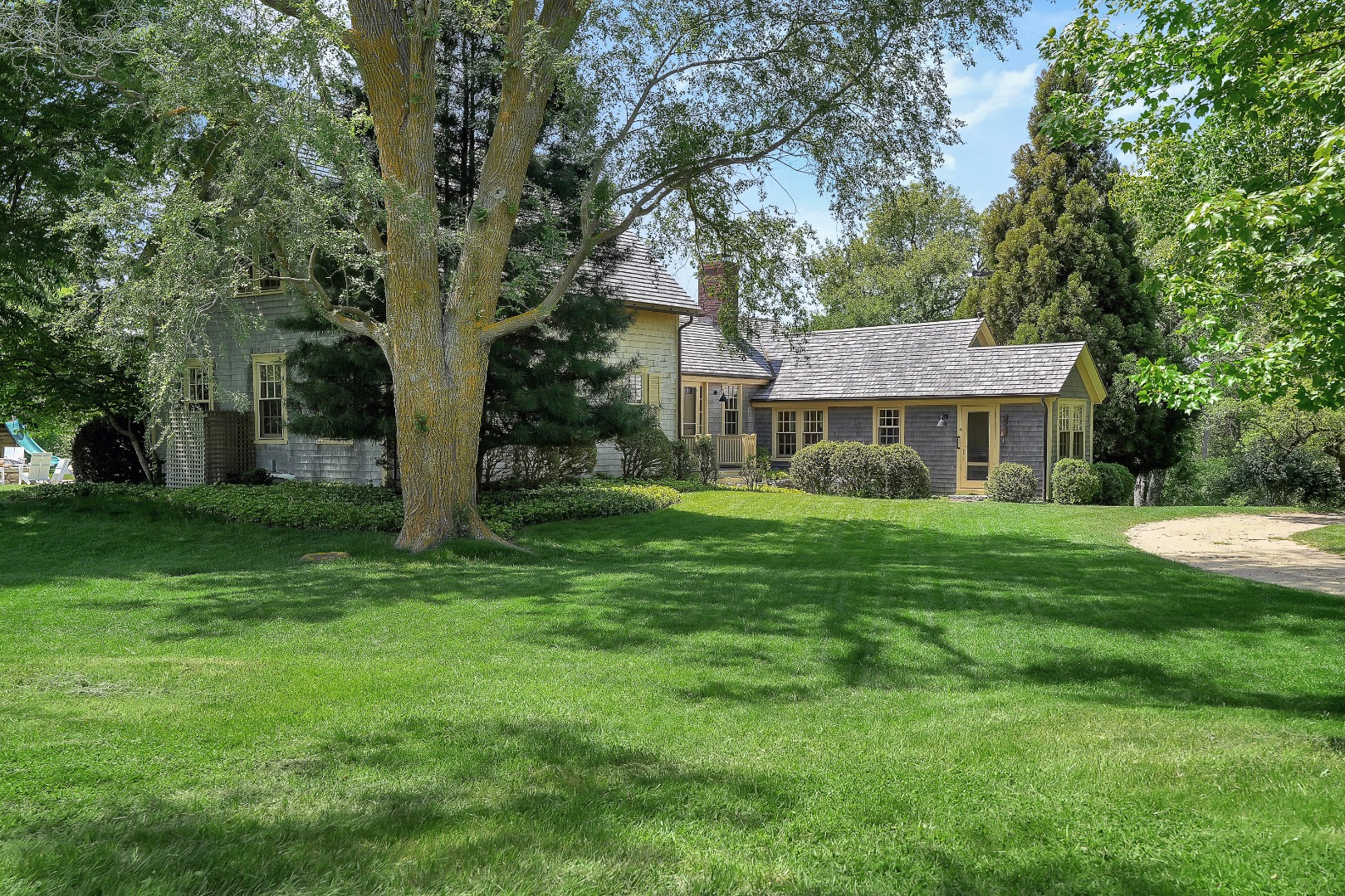 122 Old Farm Road Chilmark, MA 02535 - Photo 26 of 36 a front view of a house with a yard