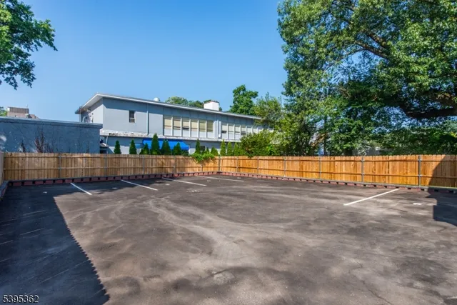 a view of yard with swimming pool and sitting area