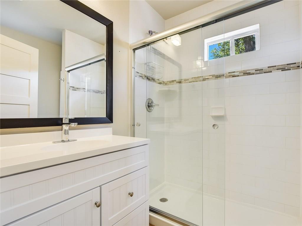 3304 Robinson Avenue, Unit 1 Austin, TX 78722 - Photo 11 of 13 Second full bathroom with updated finishes and modern design—offering comfort and privacy for roommates or guests.