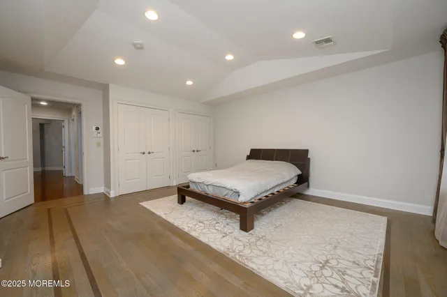 a room with a rug and a wooden floor