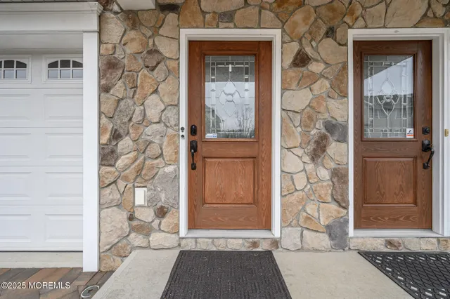 front view of a brick house with a door and a window