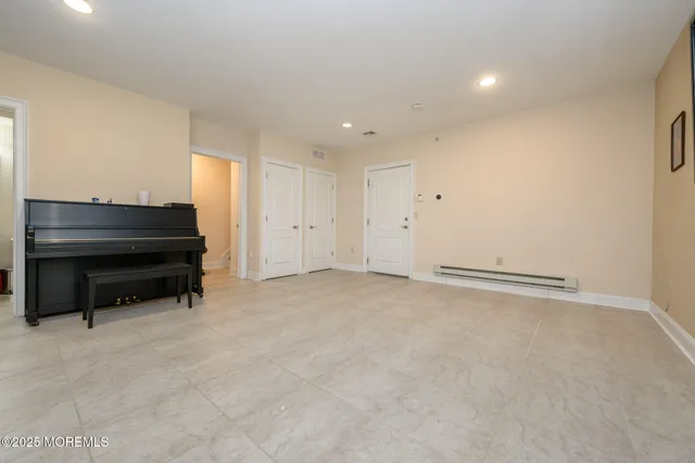 an empty room with a piano