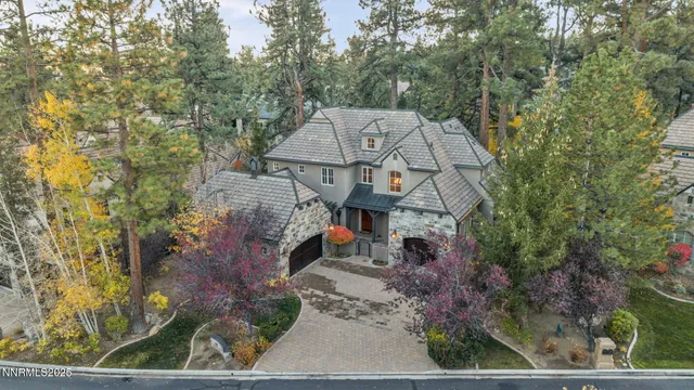 a dining room with stainless steel appliances kitchen island granite countertop a dining table chairs and view living room