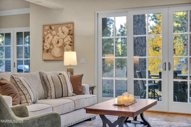 a spacious bedroom with a bed and a flat screen television