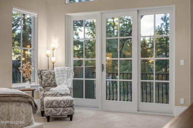 an aerial view of residential houses with outdoor space and parking
