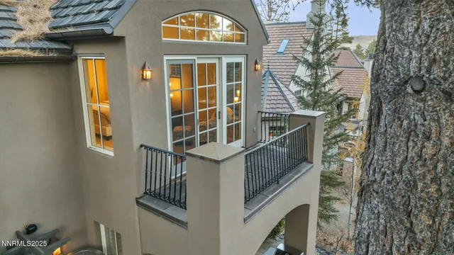 a front view of a house with a yard and a garage