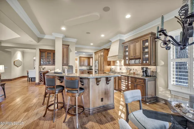 a kitchen with stainless steel appliances granite countertop sink stove top oven and refrigerator
