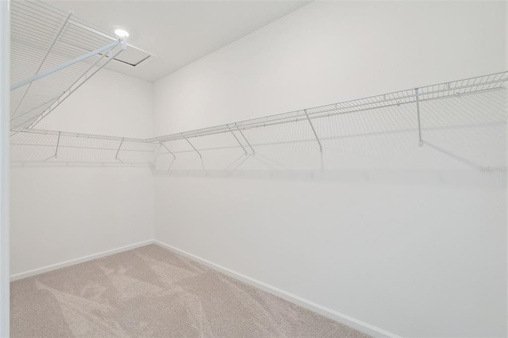 1672 Rider Rain Lane Apopka, FL 32703 - Photo 29 of 35 a view of a room with racks on the wall