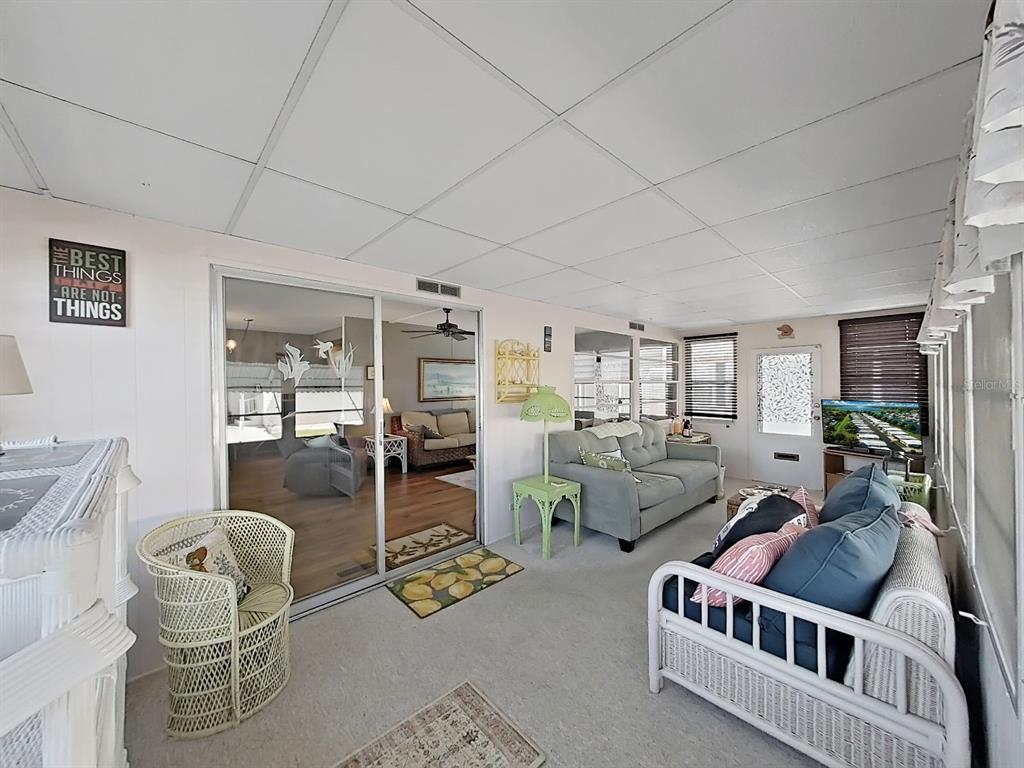 9900 Ulmerton Road, Unit 238 Largo, FL 33771 - Photo 12 of 22 a living room with furniture and a window