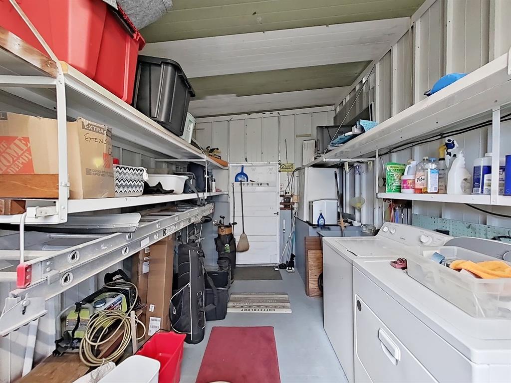 9900 Ulmerton Road, Unit 238 Largo, FL 33771 - Photo 18 of 22 a storage room with washer and dryer