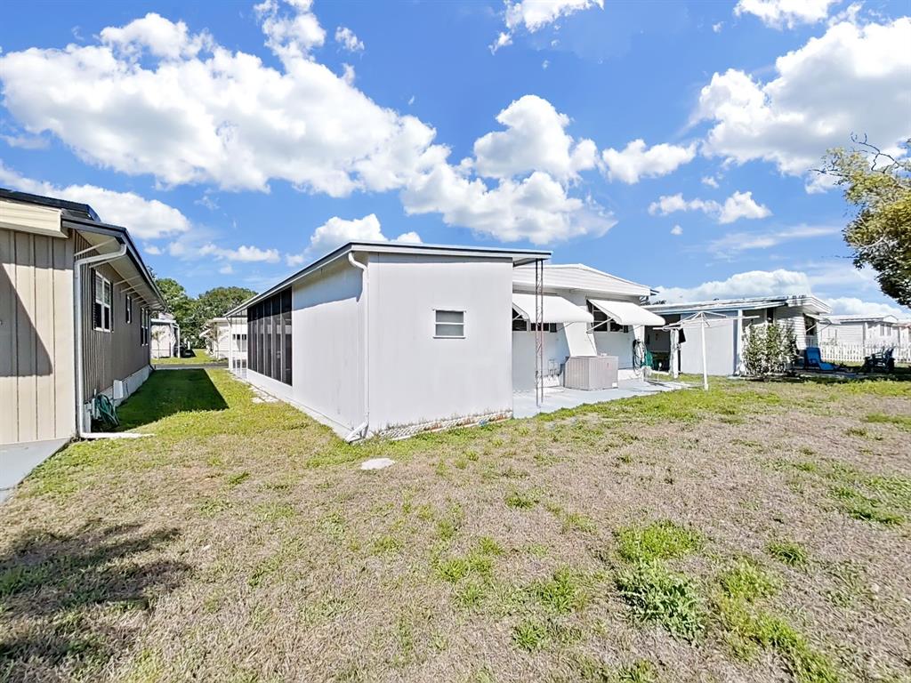 9900 Ulmerton Road, Unit 238 Largo, FL 33771 - Photo 19 of 22 a view of a house with a backyard