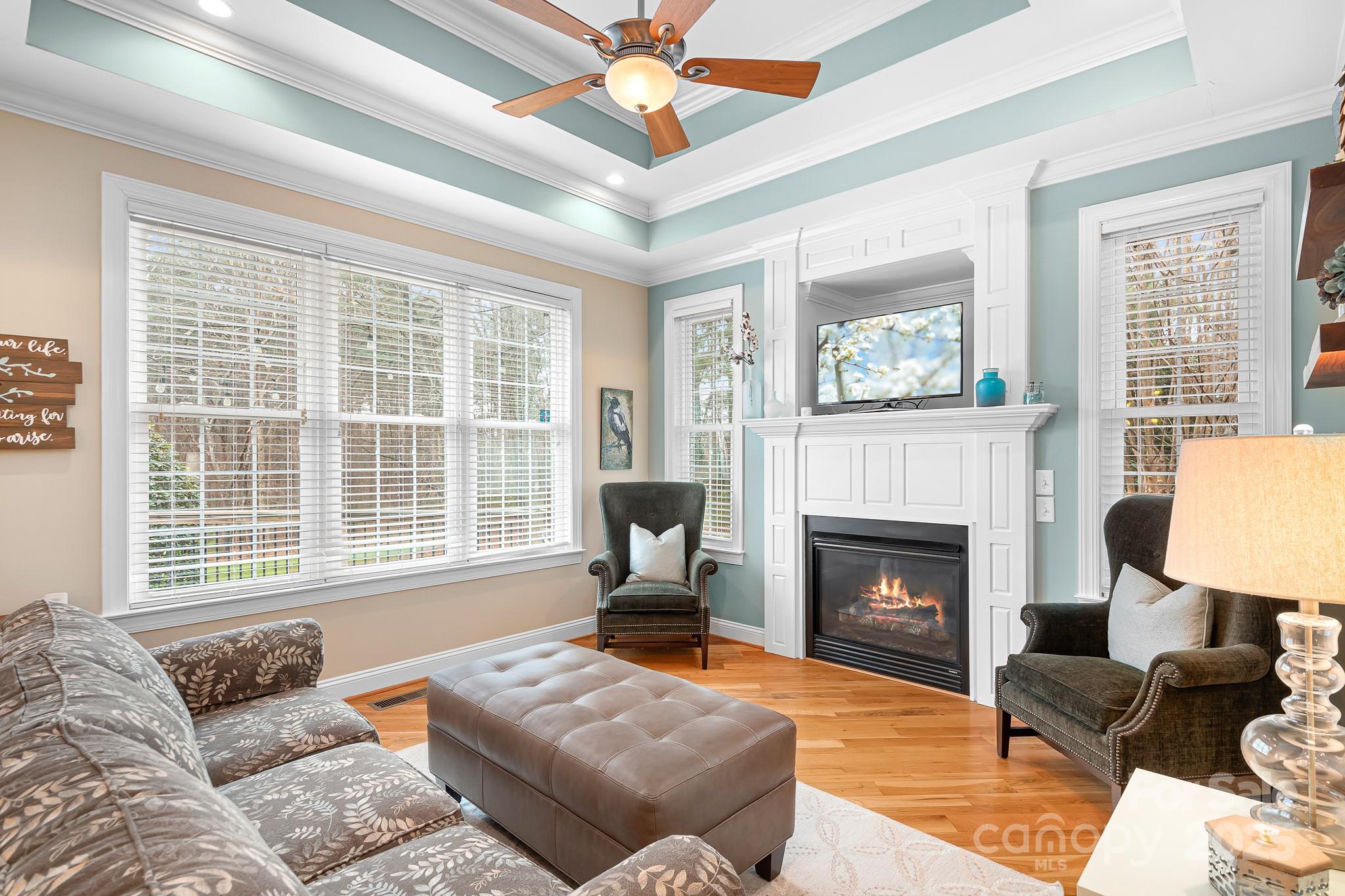 302 McCrary Road Mooresville, NC 28117 - Photo 11 of 34 a living room with furniture window and a fireplace