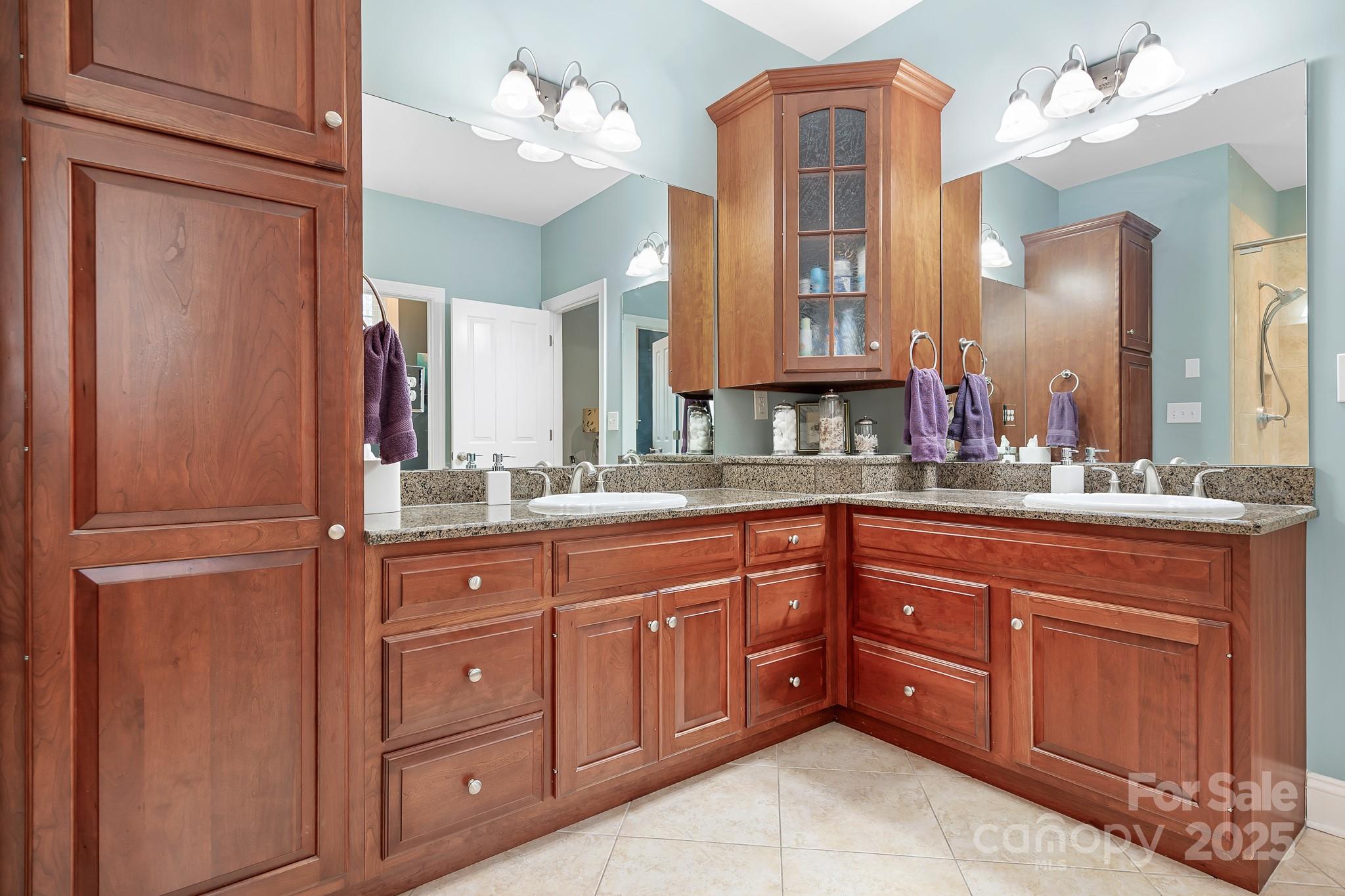 302 McCrary Road Mooresville, NC 28117 - Photo 14 of 34 a bathroom with a sink vanity and mirror