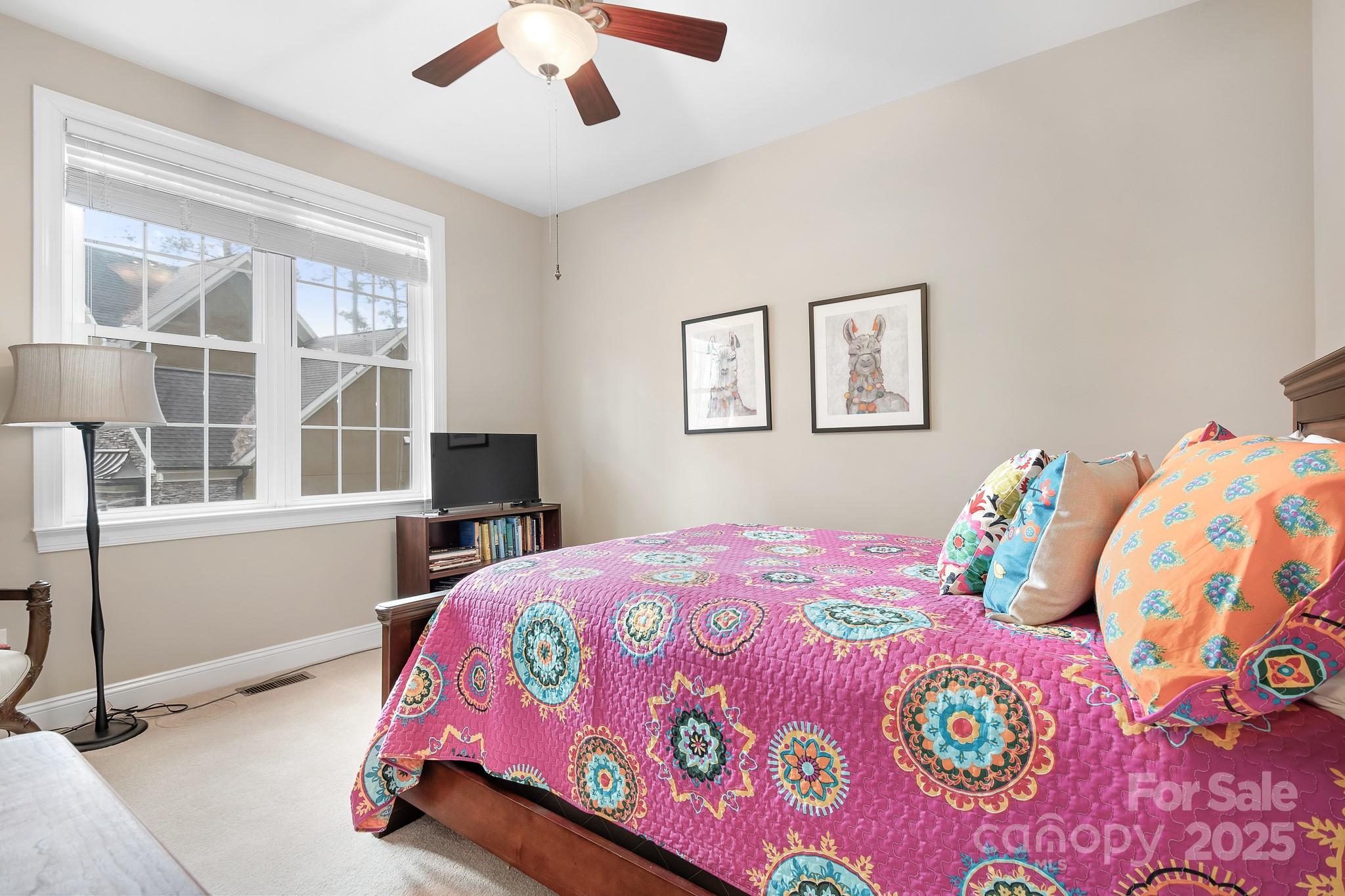 302 McCrary Road Mooresville, NC 28117 - Photo 18 of 34 a bedroom with a bed and a chandelier