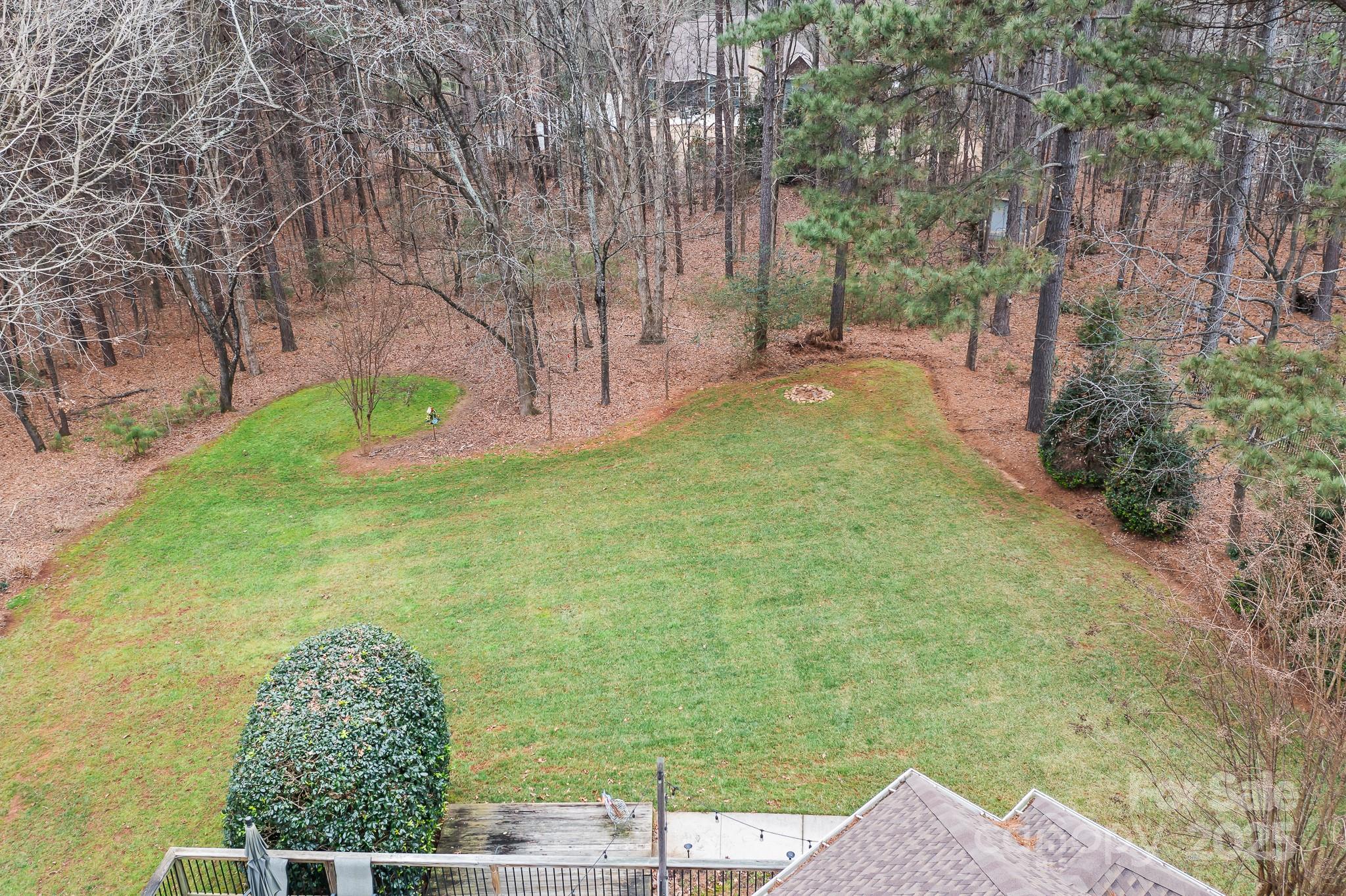 302 McCrary Road Mooresville, NC 28117 - Photo 30 of 34 a backyard of a house with lots of green space