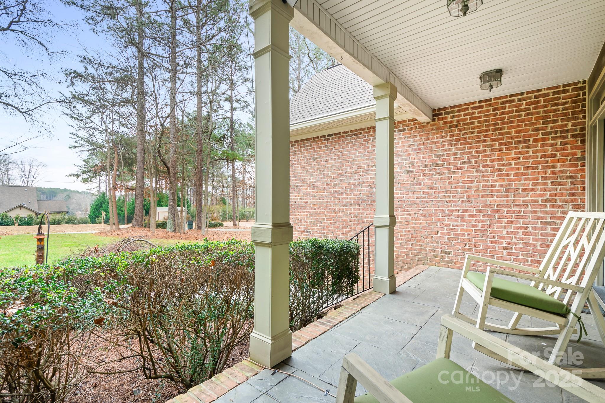 302 McCrary Road Mooresville, NC 28117 - Photo 32 of 34 a view of a porch with chairs and backyard