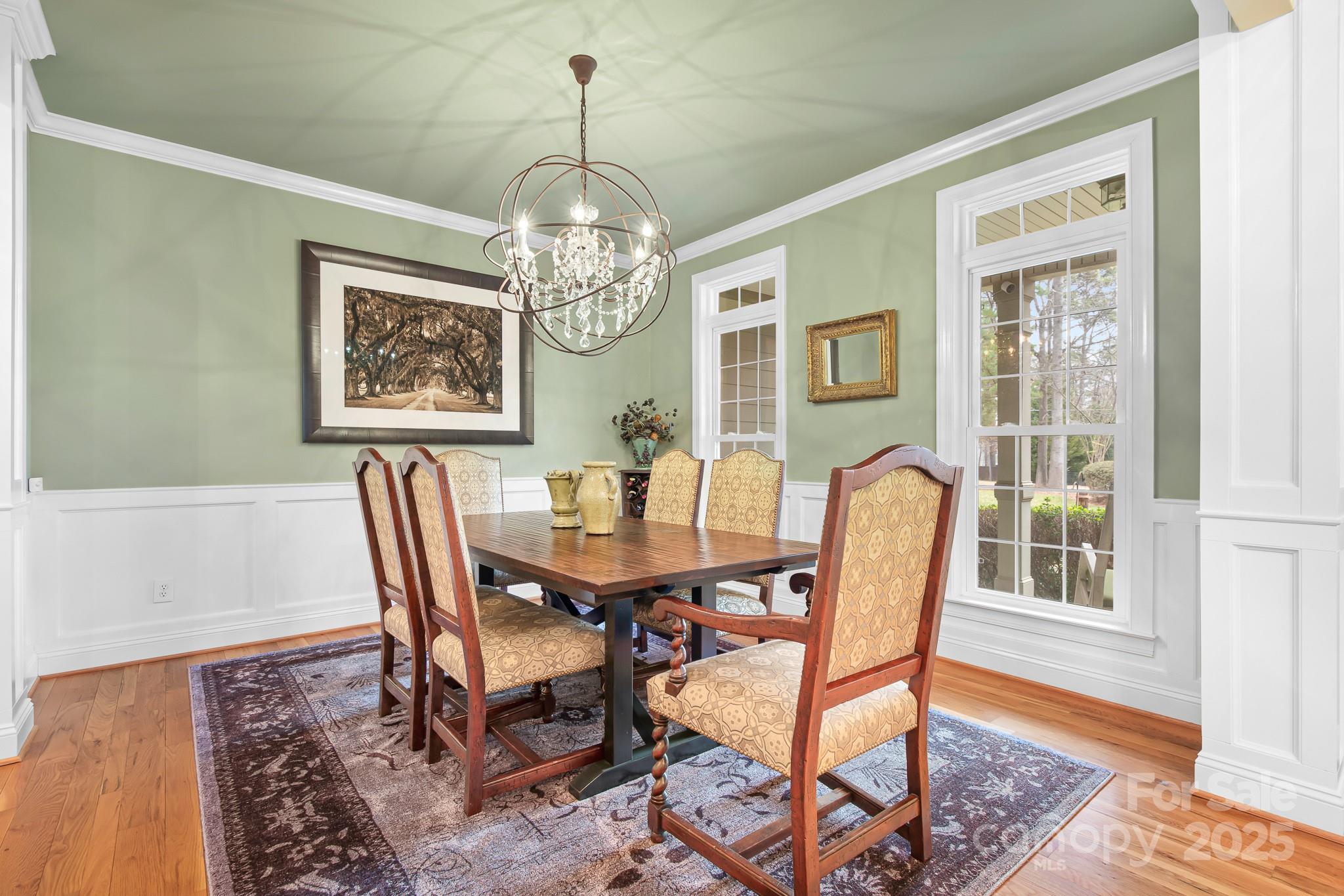 302 McCrary Road Mooresville, NC 28117 - Photo 5 of 34 a view of a dining room with furniture window and wooden floor
