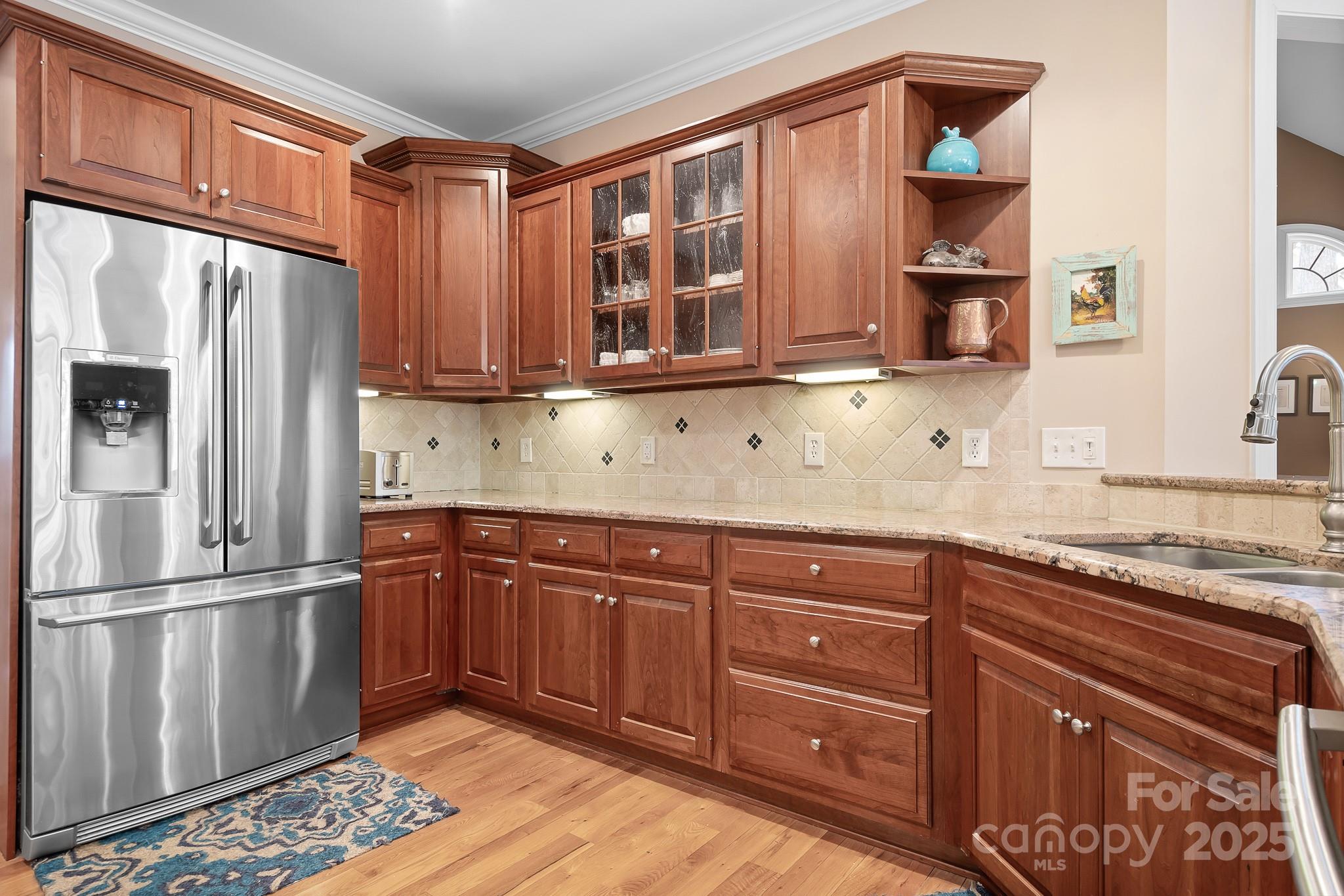 302 McCrary Road Mooresville, NC 28117 - Photo 8 of 34 a kitchen with stainless steel appliances granite countertop a refrigerator and a sink