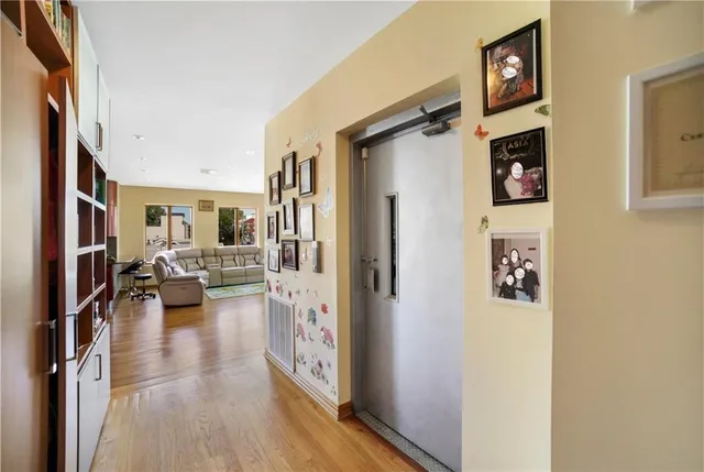 a view of living room with furniture and a fireplace